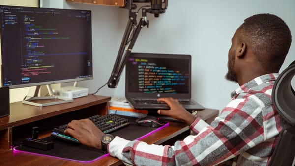 A developer working remotely at a home setup in Nairobi